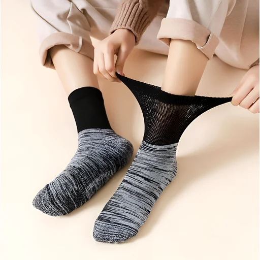 Person wearing a solid black sock and a mesh compression‑style sock side by side, showing contrast and circulation support